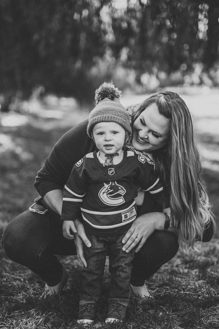 mom and son having fun playing in the leaves at a fall family photoshoot with Roxana Albusel photography